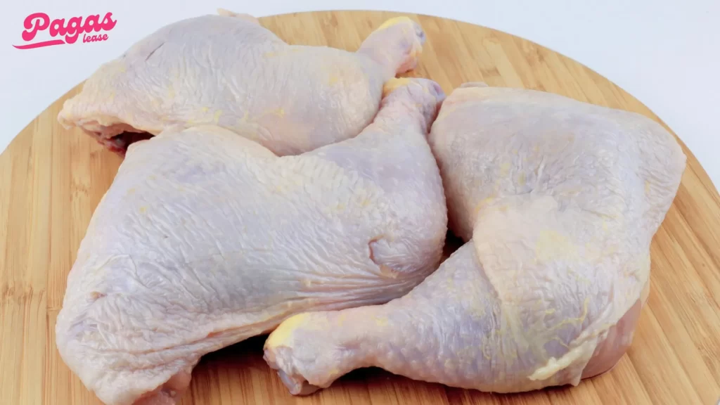 Bone-in chicken thighs prepared for boiling, showing their size and shape.