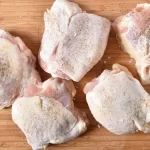 How long to boil chicken thighs seasoned and ready to cook.